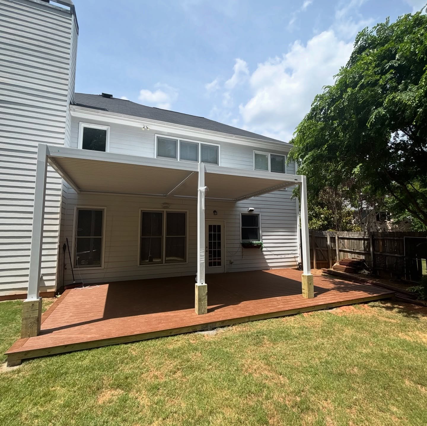 Covered deck with a metal pergola built in Smyrna, Georgia